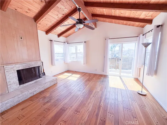 Spacious living room with wood burning fireplace