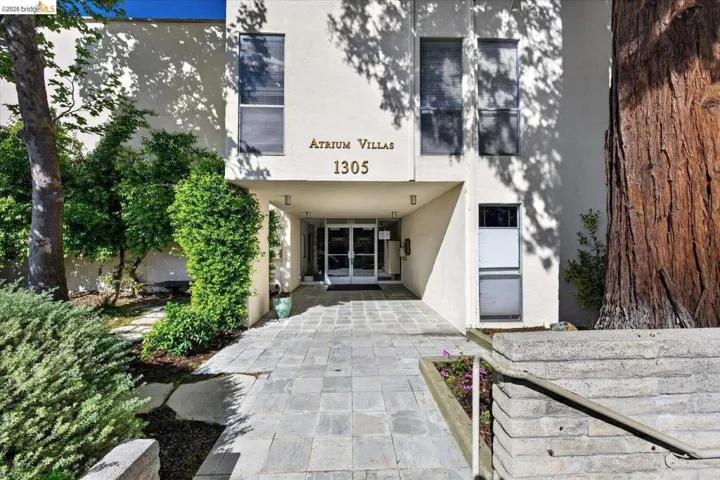 view of exterior entry with french doors and stucco siding