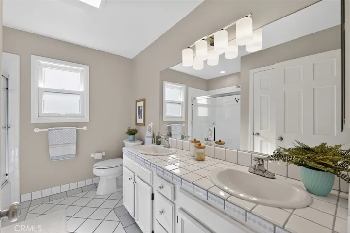 upstairs bathroom with shower over tub
