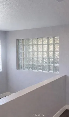 Possible glass bock window in the wall.