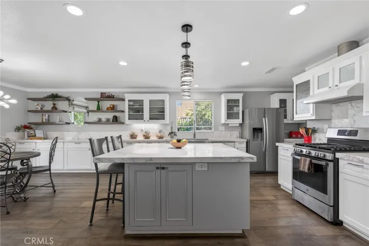 Fabulous Chef's Kitchen- Large Marble Island with storage- recessed lighting and modern light fixtures.