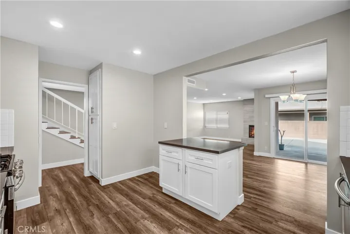 Refrigerator space next to the small island