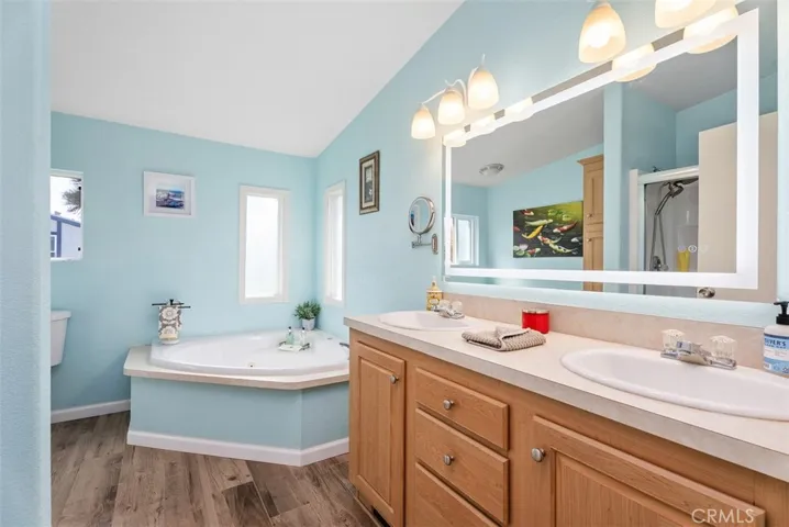Spacious primary bathroom room. Jet spa tub / separate standing shower. Dual sinks
