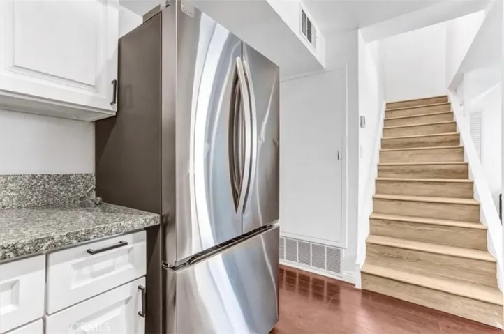 Fully updated kitchen featuring brand new appliances, countertops, stove, and fridge, finished in light natural tones.
