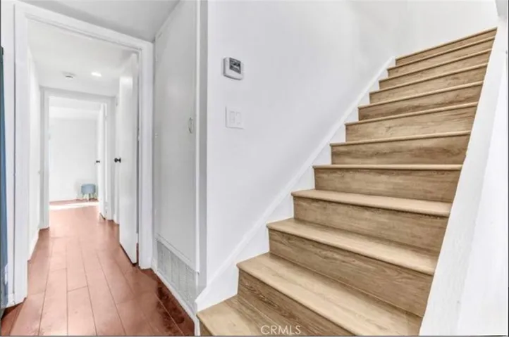 Updated stairs leading to the second floor and Bedroom 3.