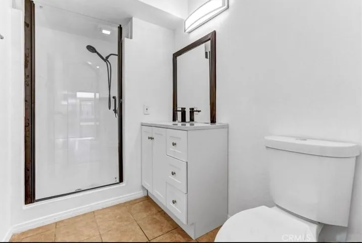 Updated bathroom with natural tones.