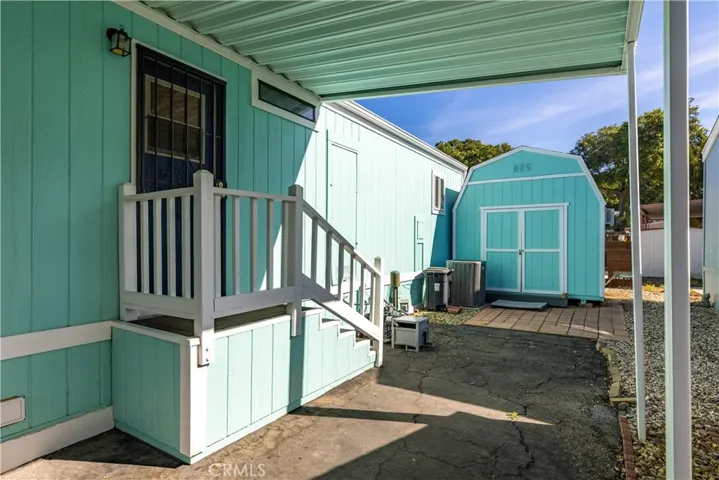 Carport and side entrance to home