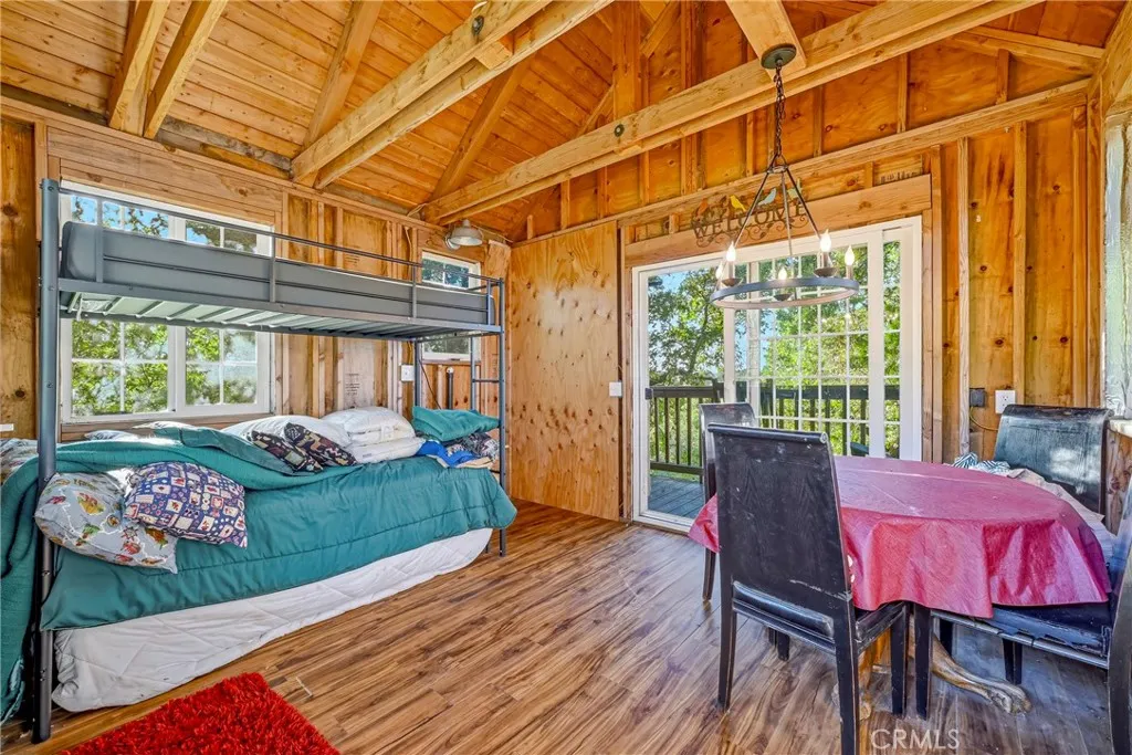 Storybook treehouse with bunks, bathroom & open beams