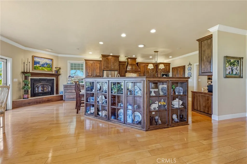 Custom built in cabinetry & fireplace in kitchen