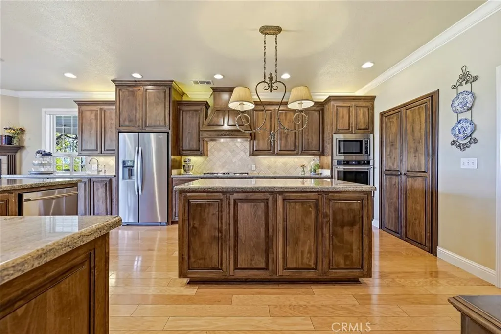 Custom cabinetry accented by plenty of lighting