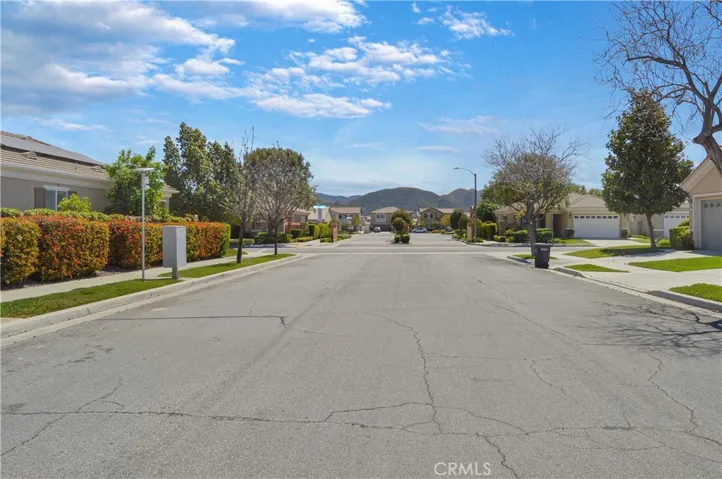 Street view with distant hills in view. The clubhouse is a short walk, bike, or drive to the east