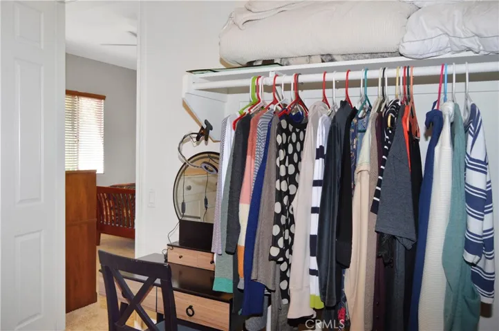 Spacious walk-in closet with outlet added for vanity (or ironing board or whatever your heart desires)
