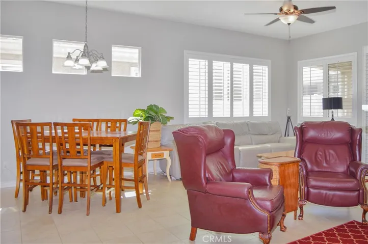 Dining area of the great room open to living area and kitchen