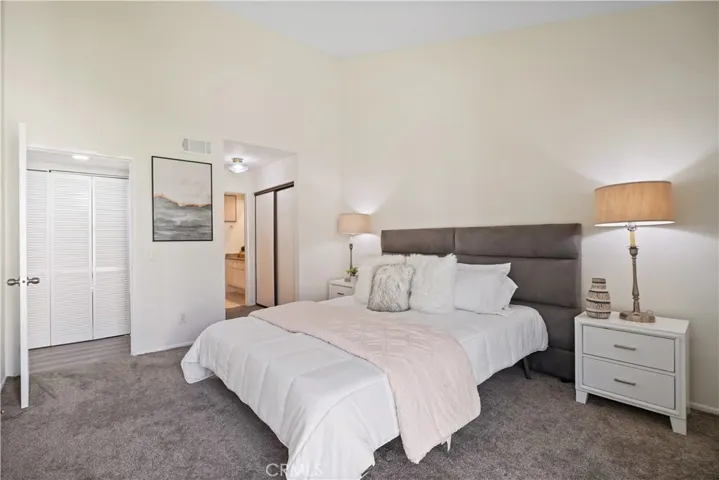 Primary suite with a private bath en-suite and three closet spaces
