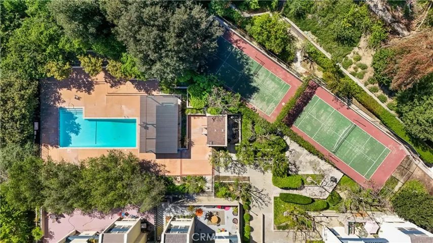 Resort-style amenities including a pool, a covered jacuzzi, pickleball court, volleyball court, gym and recreation room