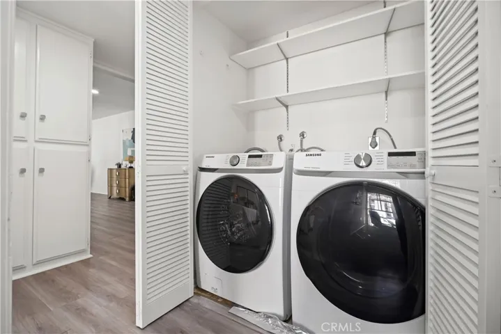 Side-by-side laundry area plus additional closet and linen storage