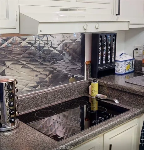 Sleek glass-ceramic cooktop featuring a smooth, modern surface with easy maintenance and efficient everyday cooking.