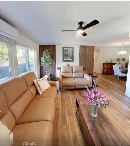 Wide-plank Lifeproof Sundance Canyon "Hickory" luxury vinyl flooring with a lifetime warranty flows throughout, while a modern ceiling fans and motorized shades add comfort and everyday convenience.