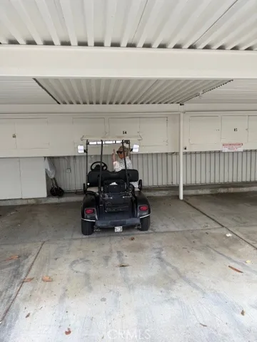Your just steps from Unit, Carport #14 Covered carport parking with convenient built-in storage cabinets for added functionality.