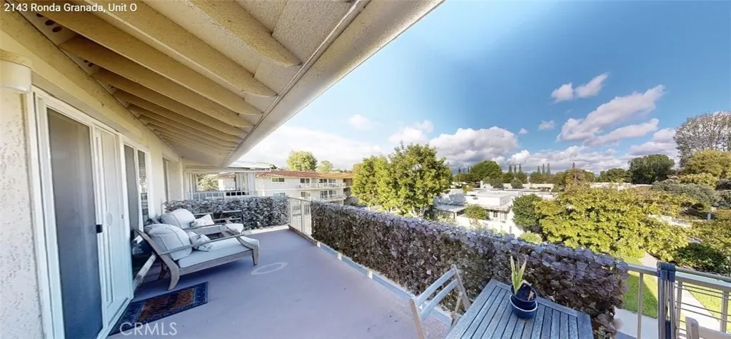 Step out from the guest bedroom onto an extra-long private terrace overlooking lush greenery with Saddleback Mountain views in the distance — perfect for relaxing, entertaining, or enjoying quiet mornings.