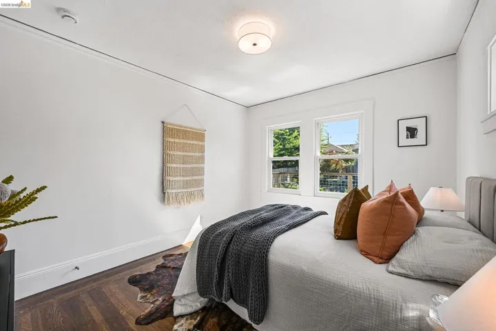 Bedroom with baseboards and wood finished floors