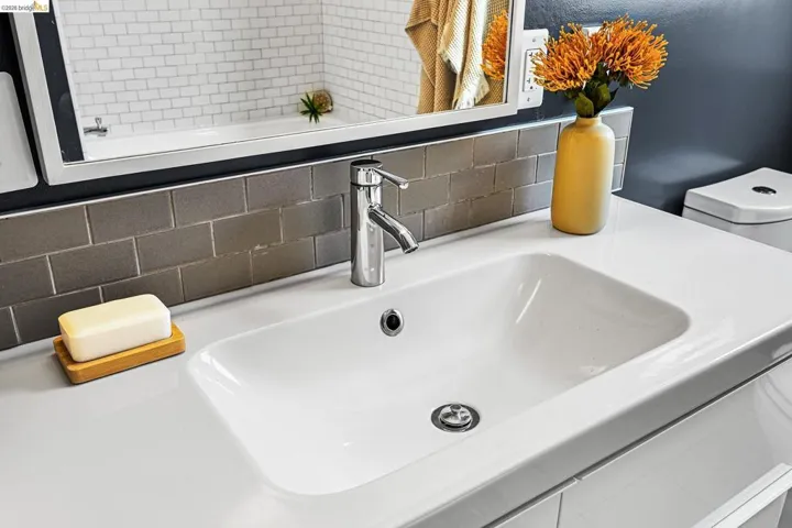 Bathroom view of vanity and backsplash