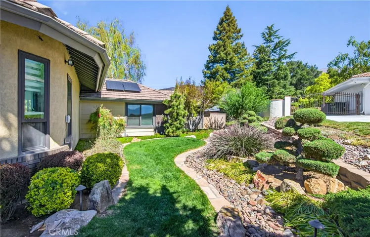 Side yard showcasing the mature landscaping