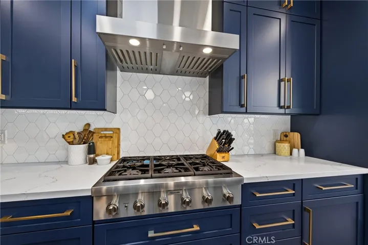 No details spared in this kitchen, from the cabinetry to countertops to the backsplash