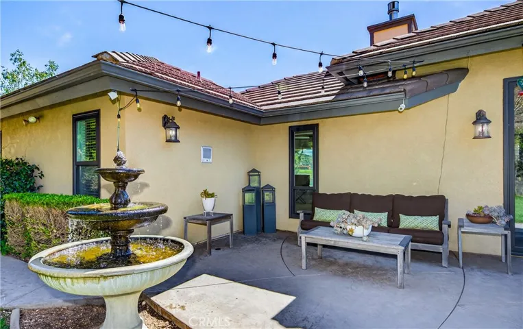 Back yard patio and fountain that stays with the home