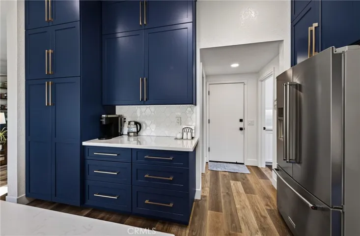 Kitchen to laundry, guest bath and garage entry