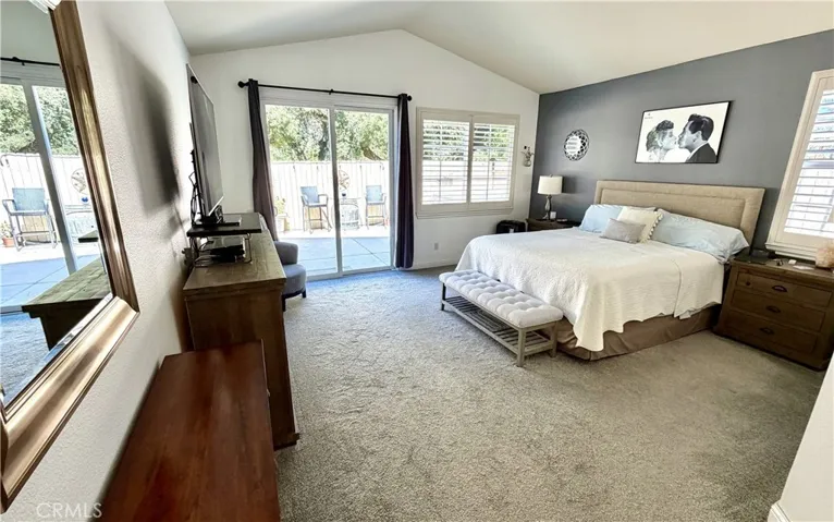 Primary bedroom with door to back patio