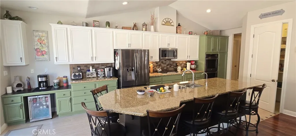 Granite top island that can seat 6 people.