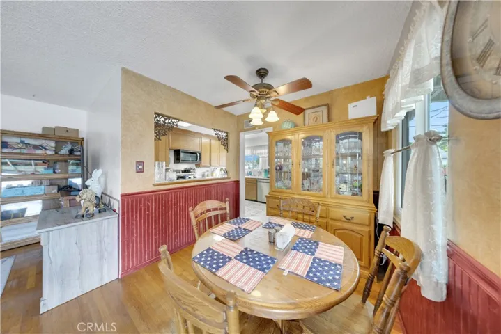 Dining room with a peel into kitchen