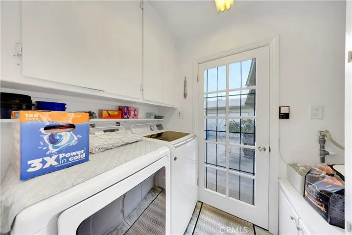 laundry room off kitchen with door to backyard and garage