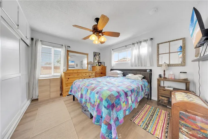Primary bedroom - king size bed - one whole wall of storage