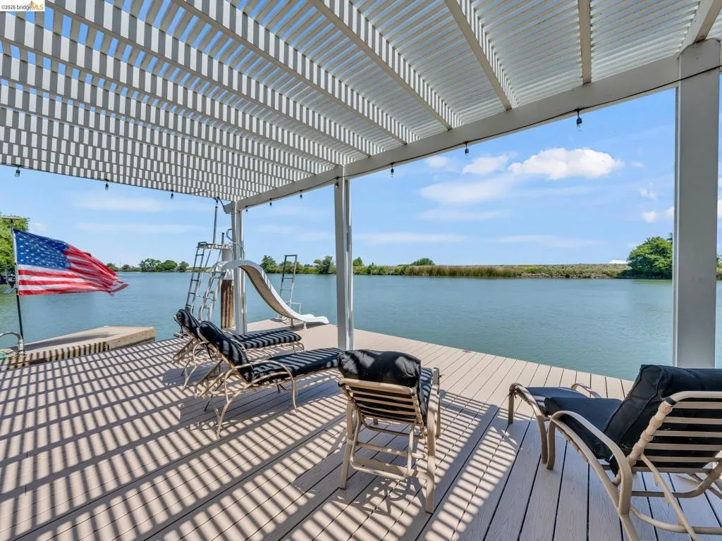 Dock area featuring a water view