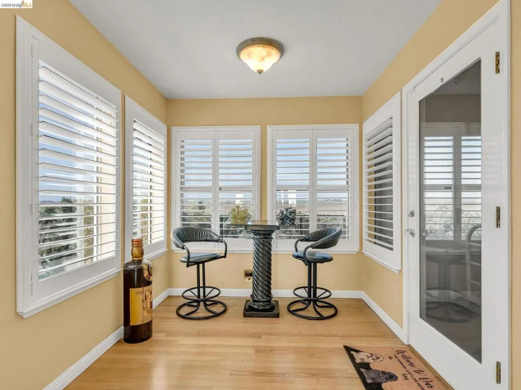 Dining room with light wood-type flooring and baseboards