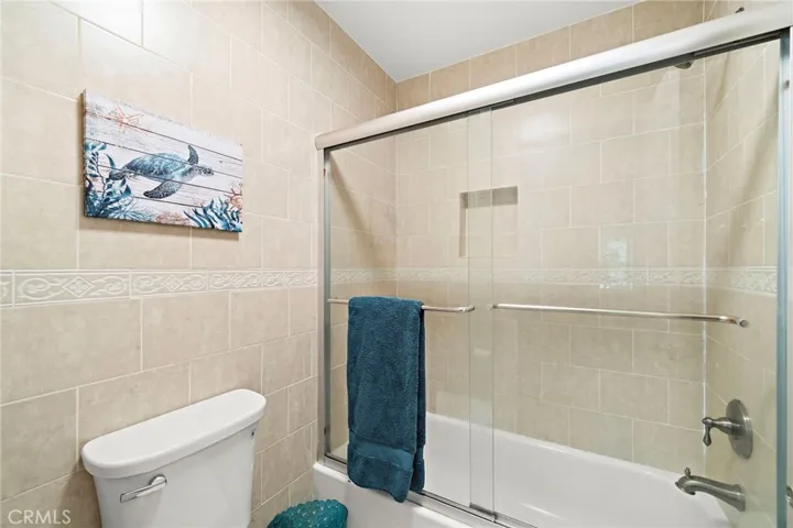 Tub shower combo with glass enclosure