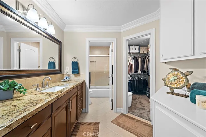 Primary bathroom with upgraded vanity and walk in closet