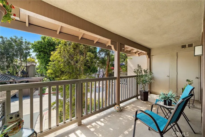 Enjoy the peaceful balcony with views of trees