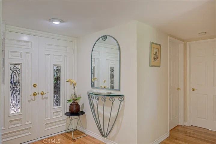 Beautiful double leaded glass doors as you enter the foyer to the home.