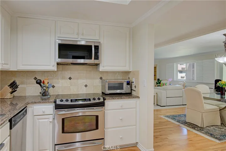 Beauriful remodeled Kitchen looking into the dining area and living room.