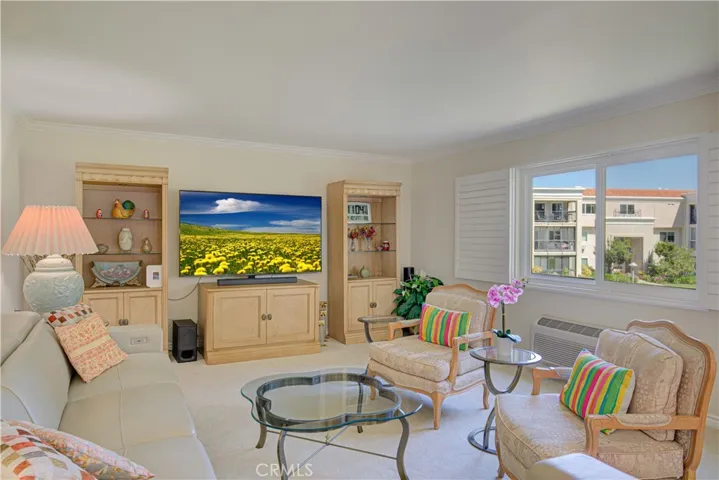 Living room with cozy comfy furniture and recliner or two, and for your enjoyment is large Big screen TV