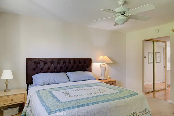 Another view of the Primary Bedroom with a King sized bed & access to the Primary bathroom near by with a nice walk in shower.