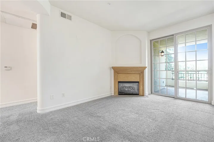 Family room with fireplace and access to balcony #2