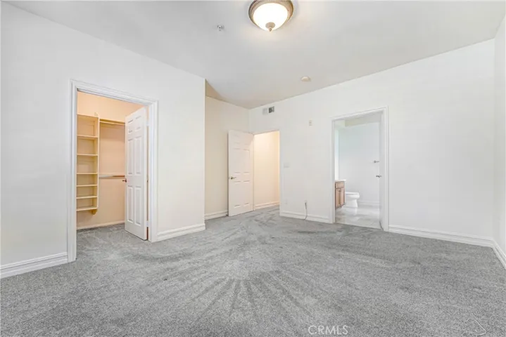 Primary bedroom with en-suite primary bath and walk in closet.
