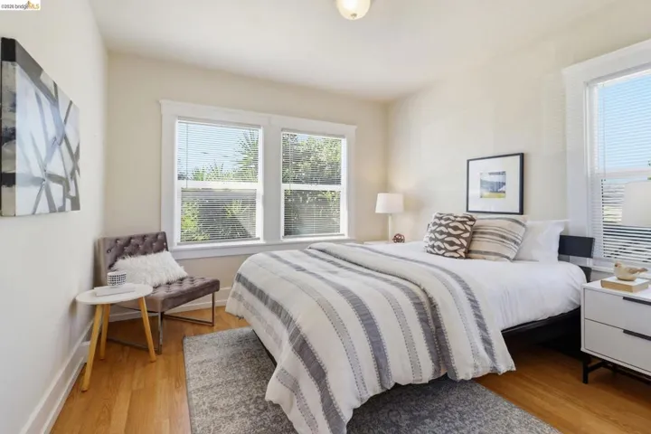 Bedroom with light wood-style floors and baseboards