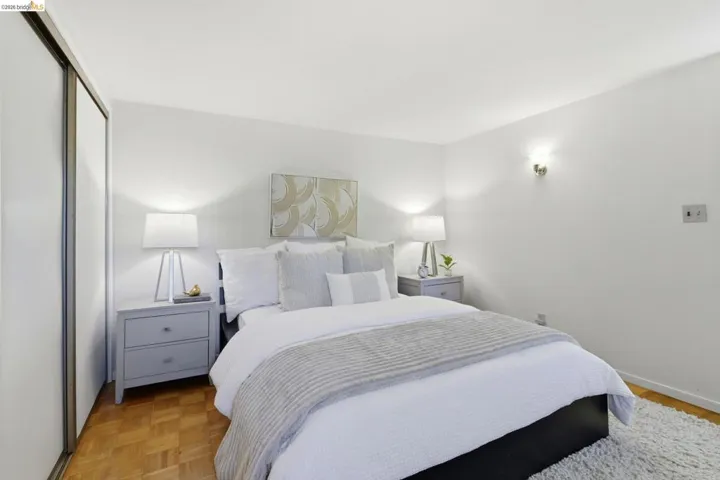 Bedroom featuring parquet flooring and a closet