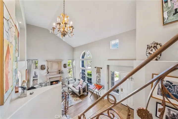 Upstairs to Living Room and Entry Foyer.