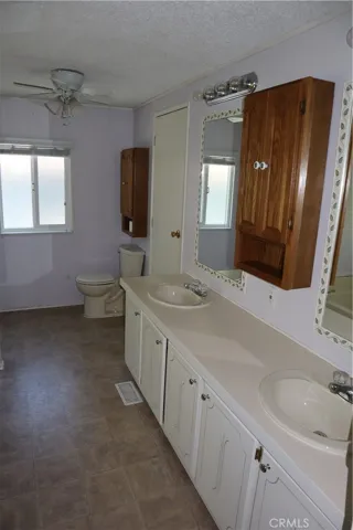 Dual sink large primary bathroom Jack and Jill access off laundry room